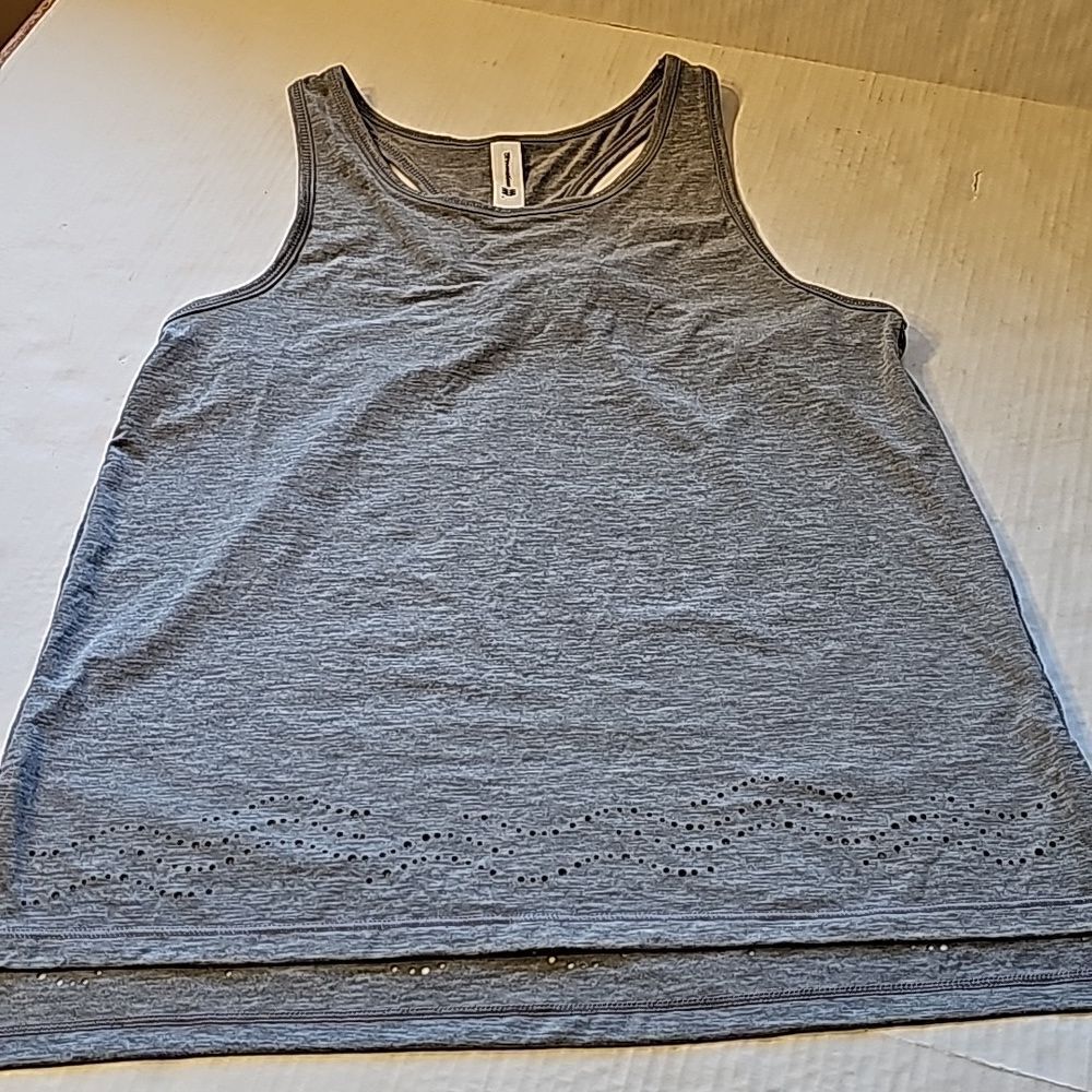 Gray racer back tank top features laser cut bottom size XS